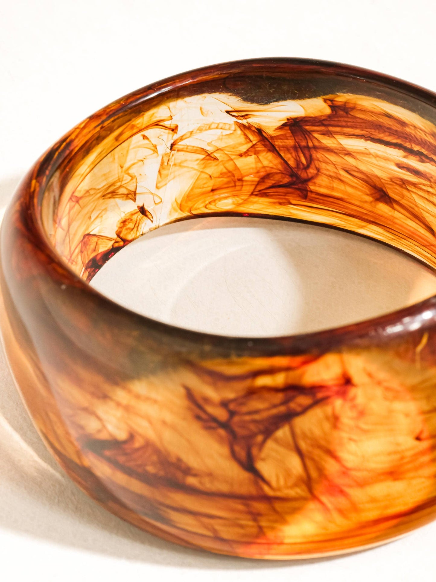 Brown tortoise bangle on a white background
