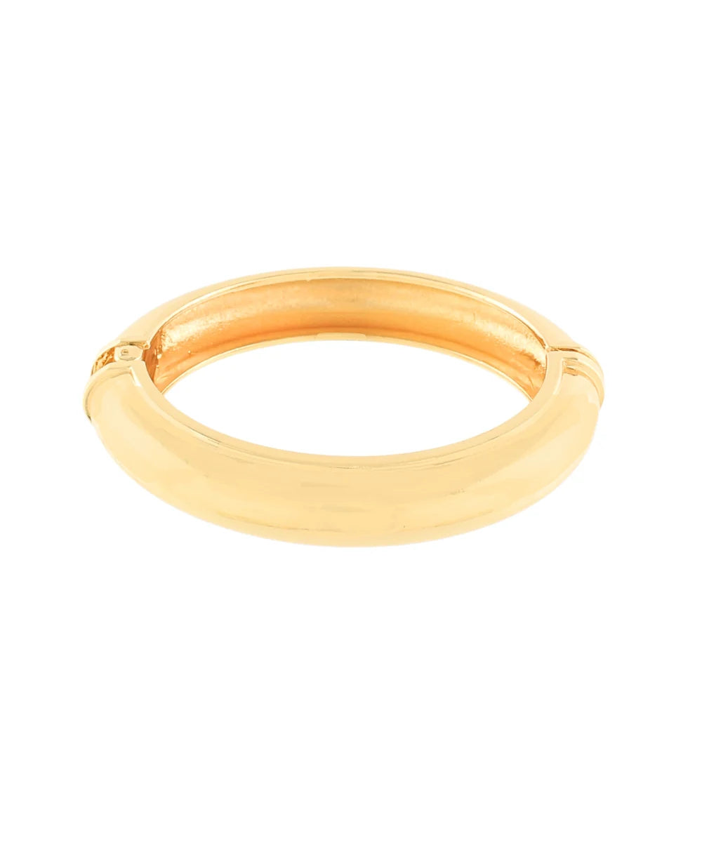 Gold bangle on a white background