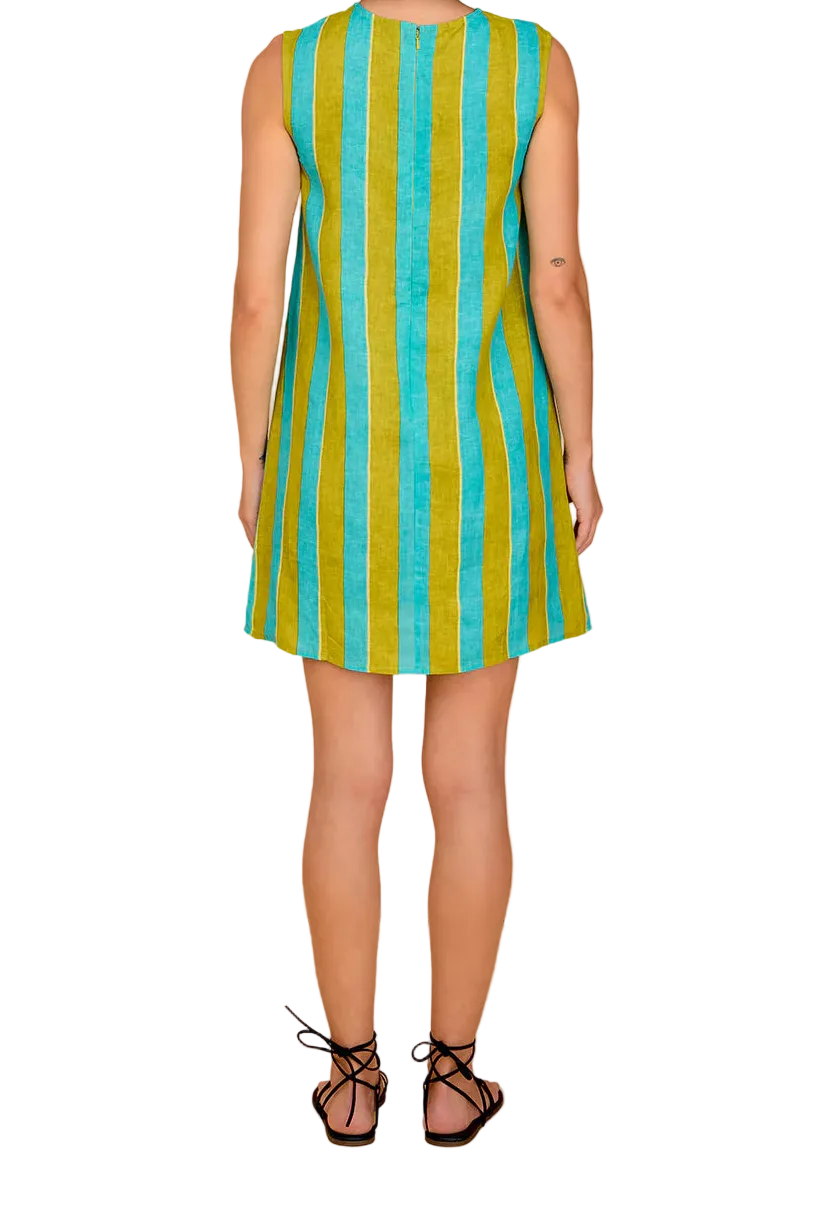 Woman wearing a sleeveless dress with green and blue vertical stripes against a beige background