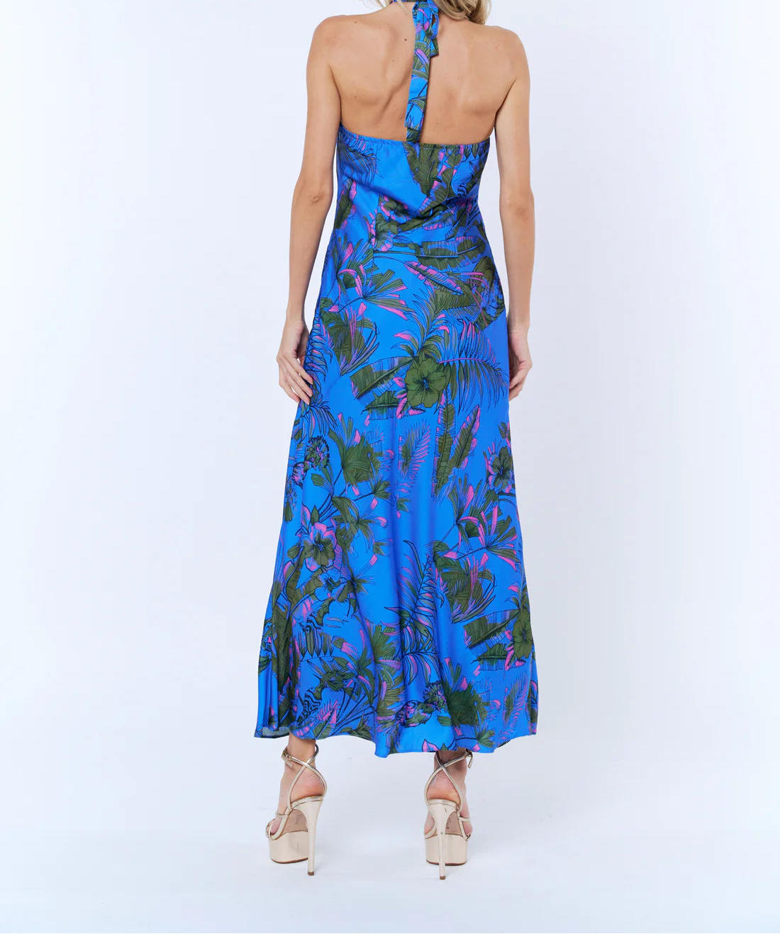 woman wearing silky blue halter dress