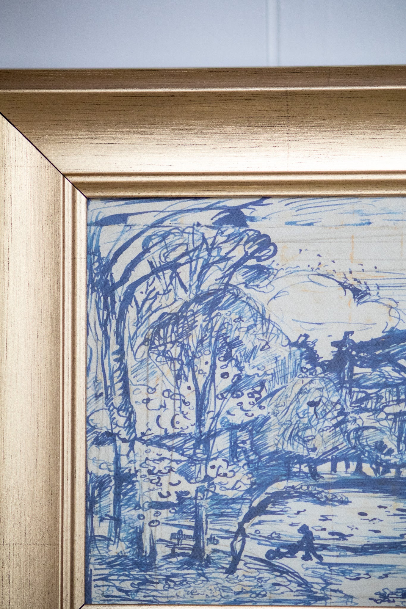 Framed artwork with blue ink on paper, depicting a landscape.
