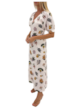 Woman wearing a floral nightgown in a bedroom setting