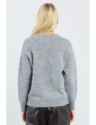 Person wearing a gray sweater on a white background