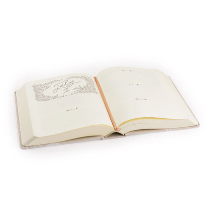 Open book with decorative text on a white background