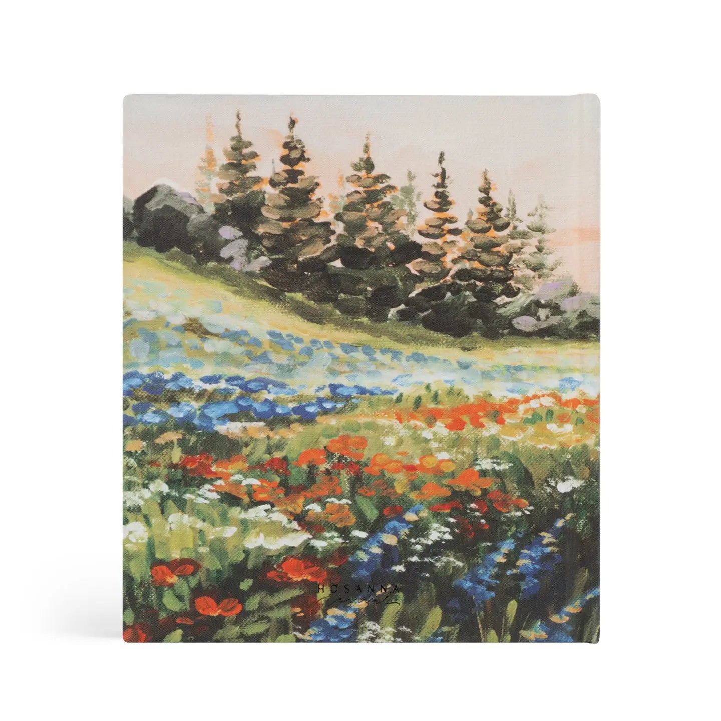 Notebook with a painting of a field with flowers and trees on the cover