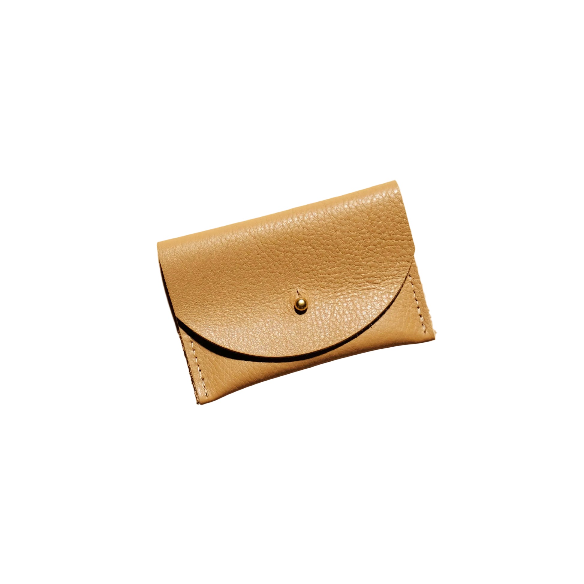 Beige leather wallet on a beige background