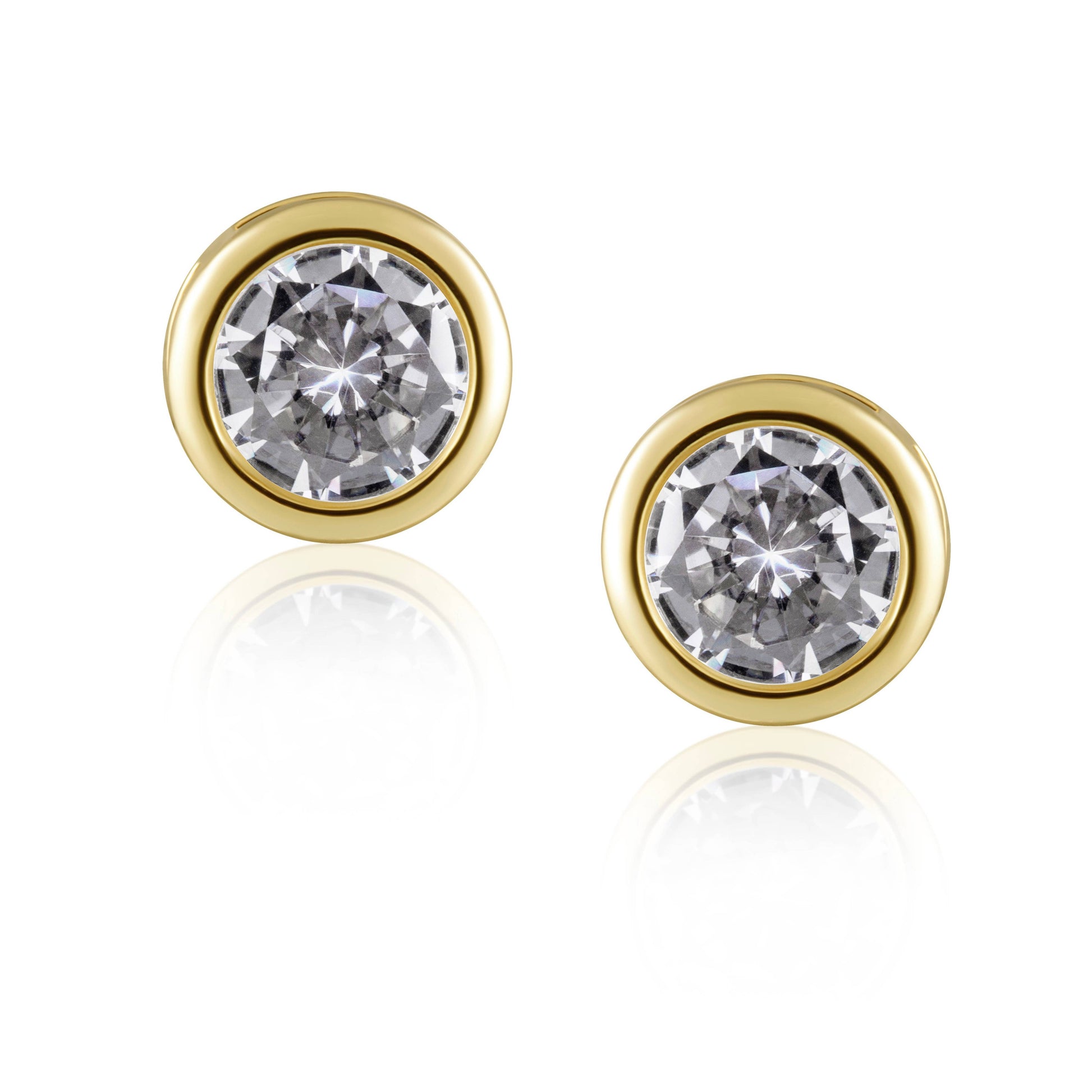 Gold earrings with clear gemstones on a white background