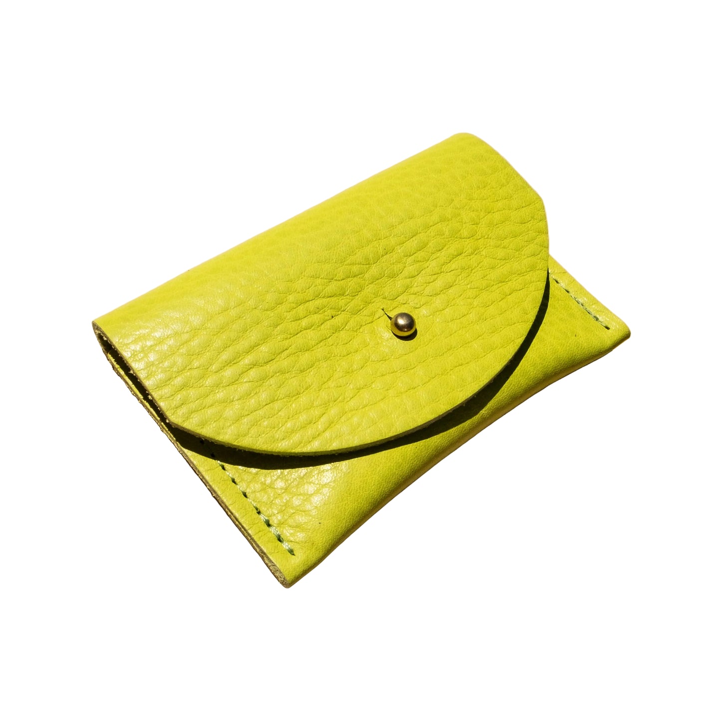 Green leather wallet on a beige background