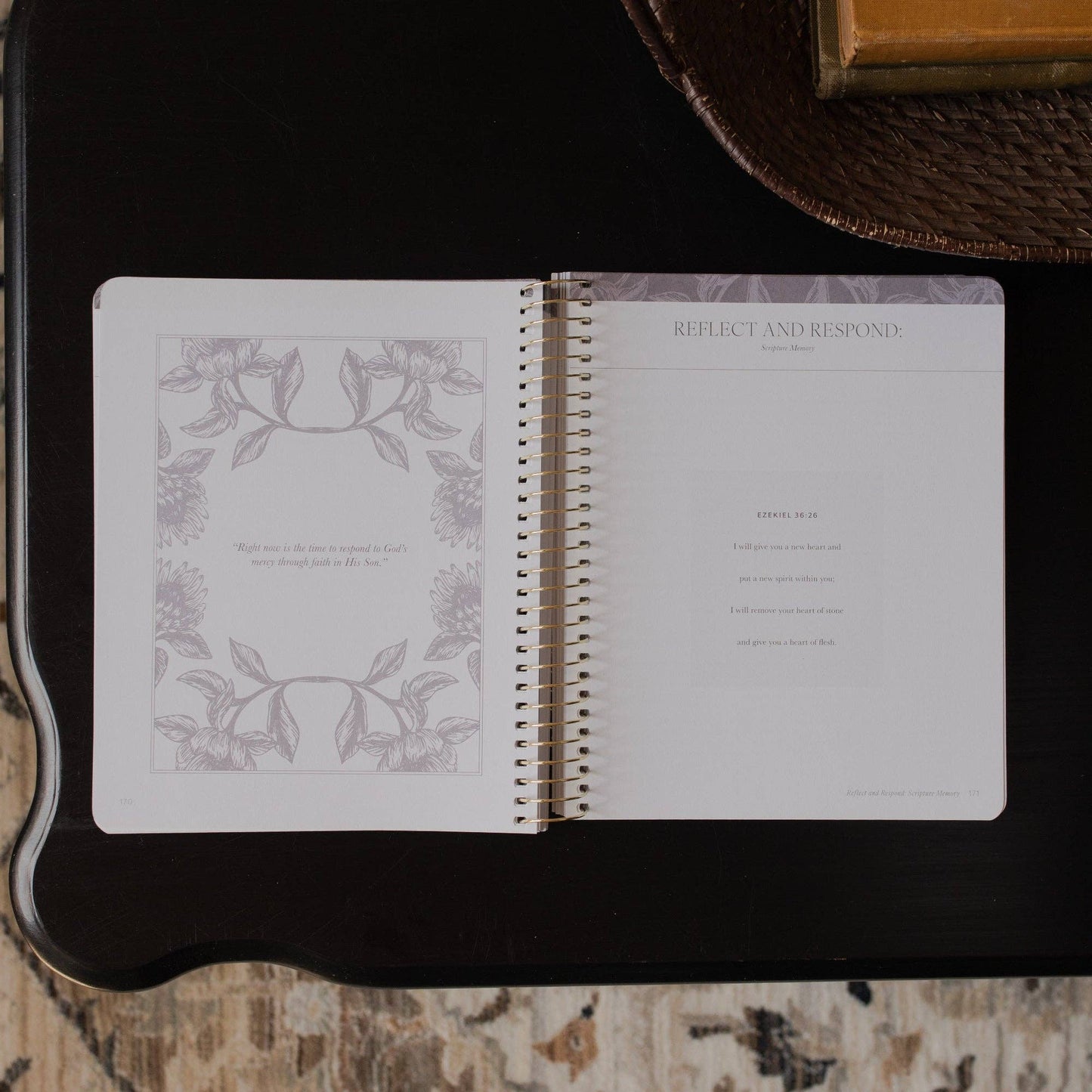 Open notebook with decorative pages on a dark surface