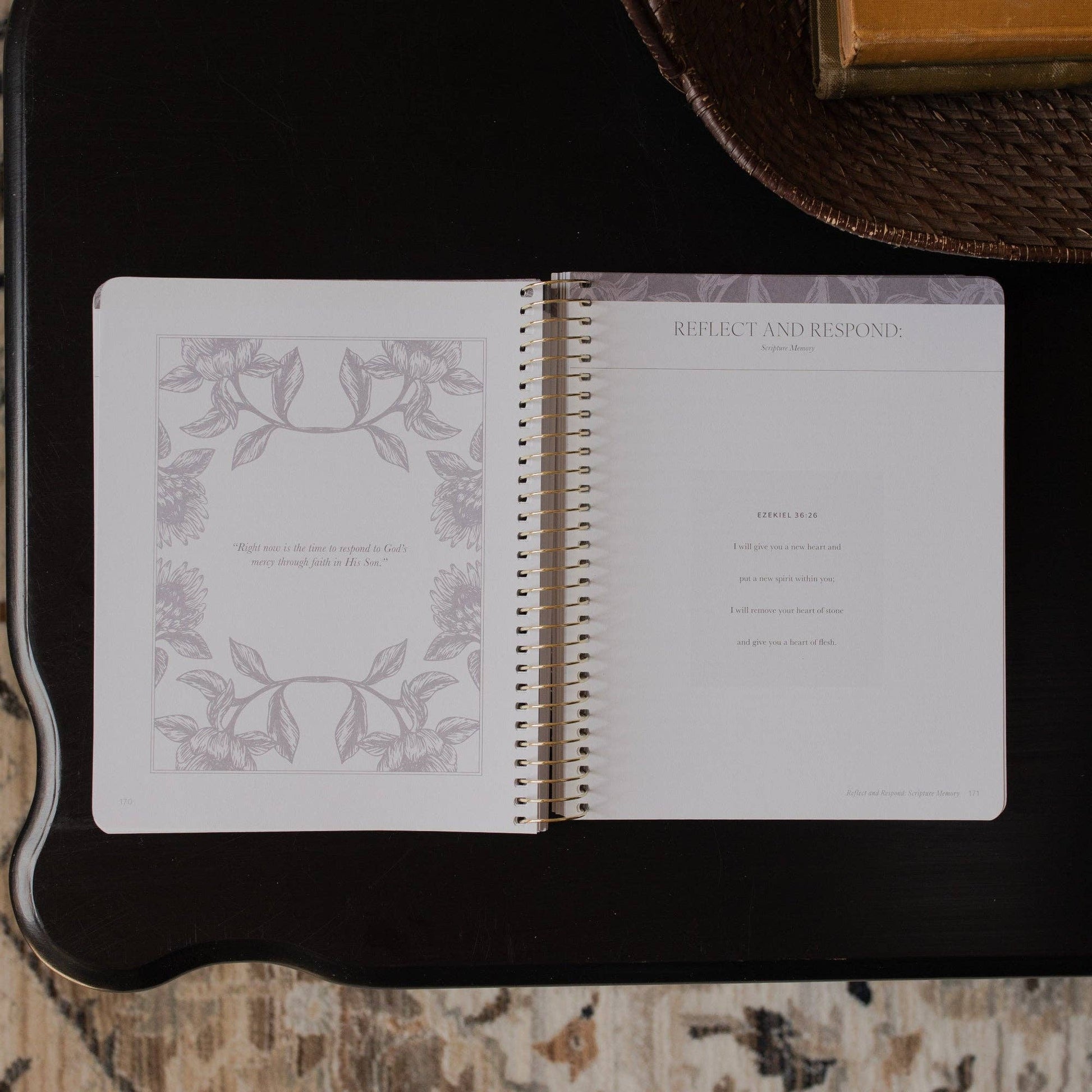 Open notebook with decorative pages on a dark surface
