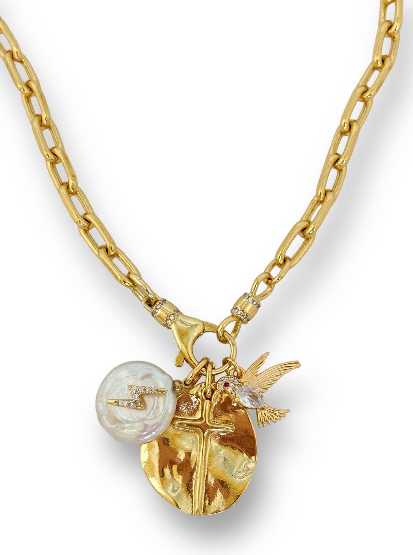 Gold necklace with various charms on a white background