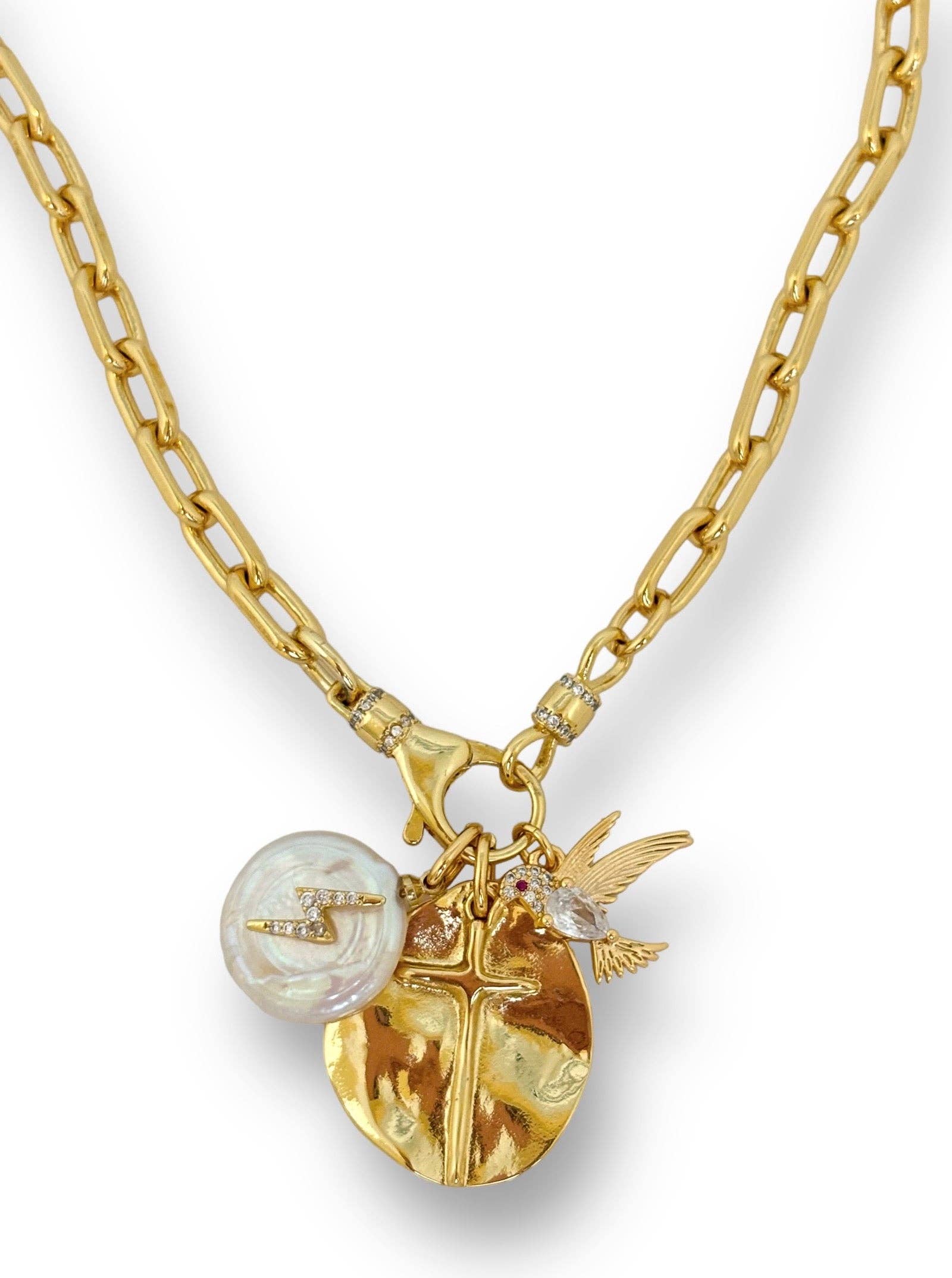 Gold necklace with various charms on a white background