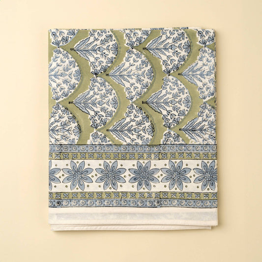 Decorative fabric with a blue and green pattern on a beige background