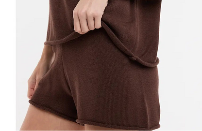 Woman wearing a brown outfit on a white background