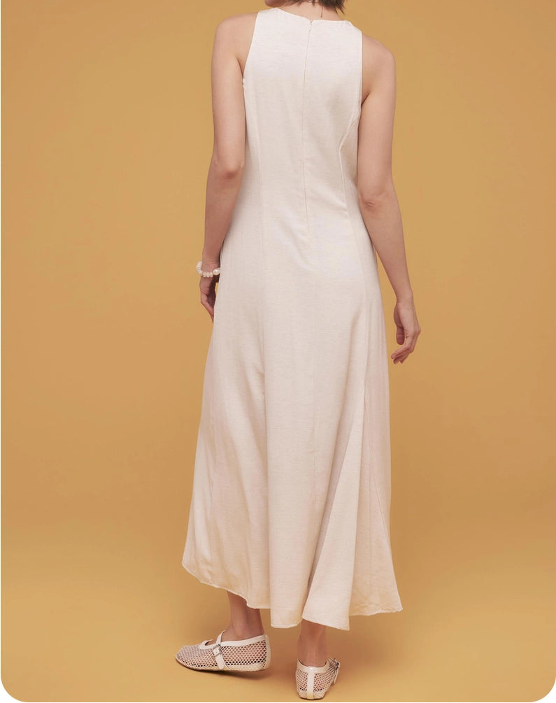 Woman wearing a white dress against a yellow background