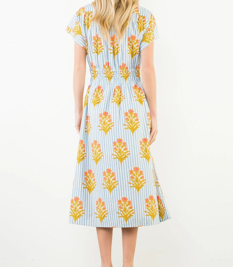 Woman wearing a floral dress with a white background