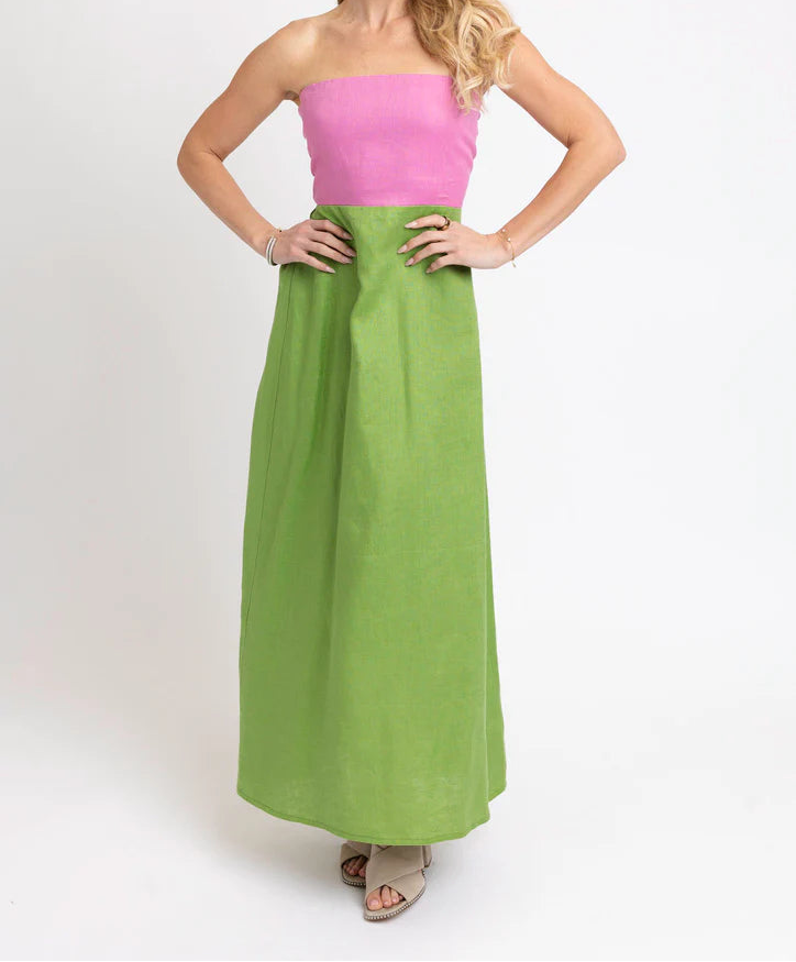Woman wearing pink and green strapless dress