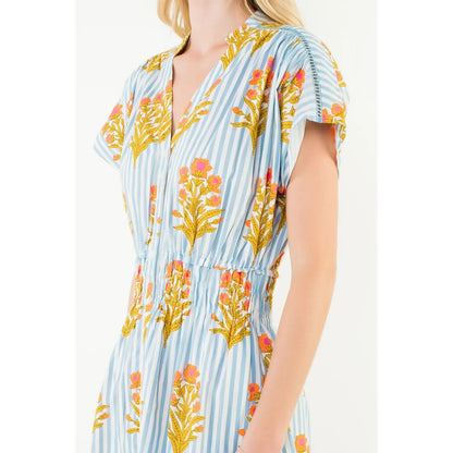 Woman wearing a floral dress with a white background