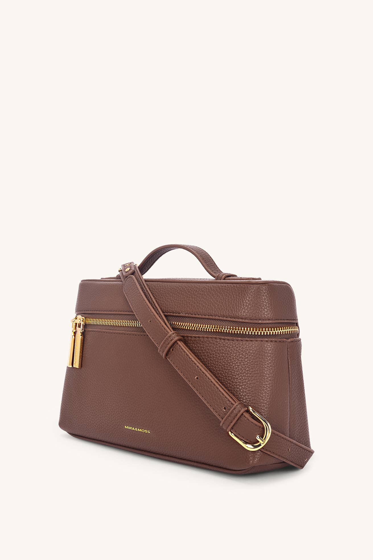 Brown leather handbag with gold zipper and hardware on a white background