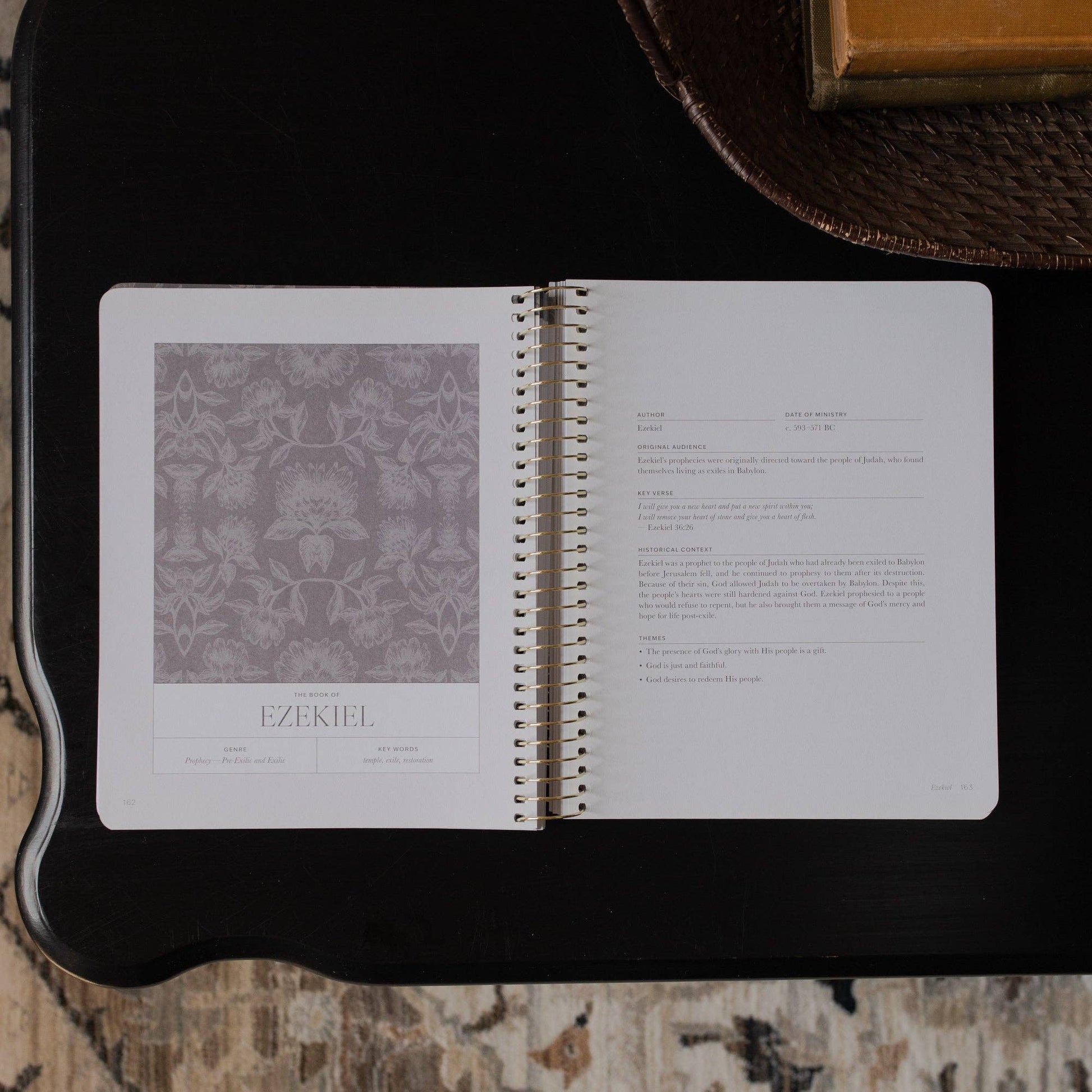 Open notebook with text and a pattern on a textured surface