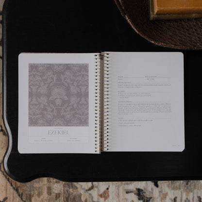 Open notebook with text and a pattern on a textured surface