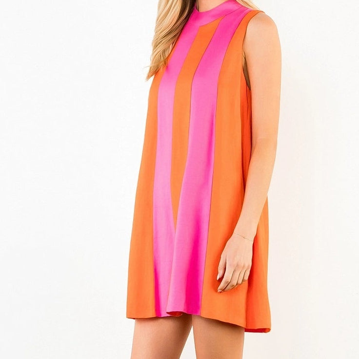Woman wearing a colorful dress on a white background