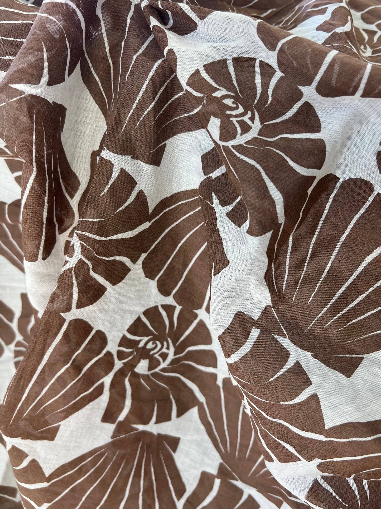 Brown and white shell pattern fabric texture
