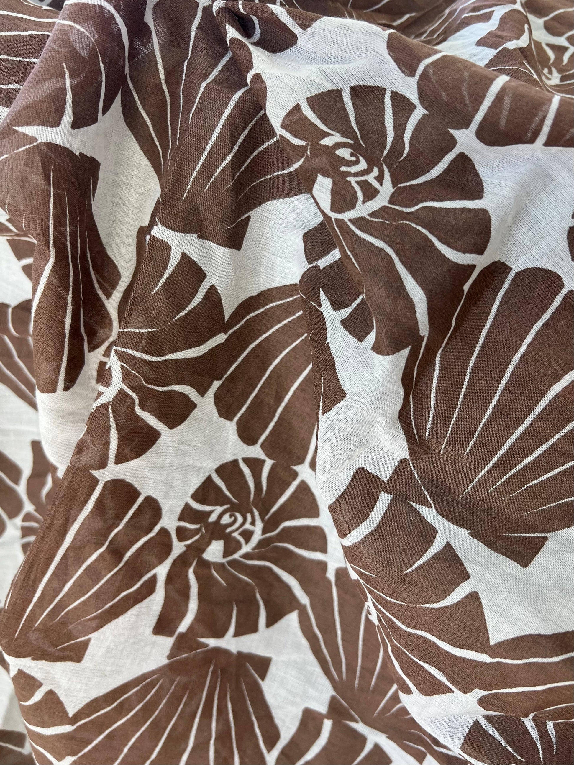 Brown and white shell pattern fabric texture