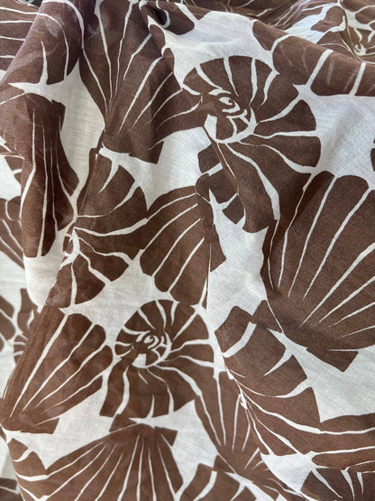 Brown and white shell pattern fabric texture