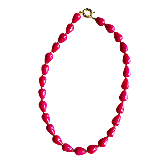 Necklace with pink beads on a white background