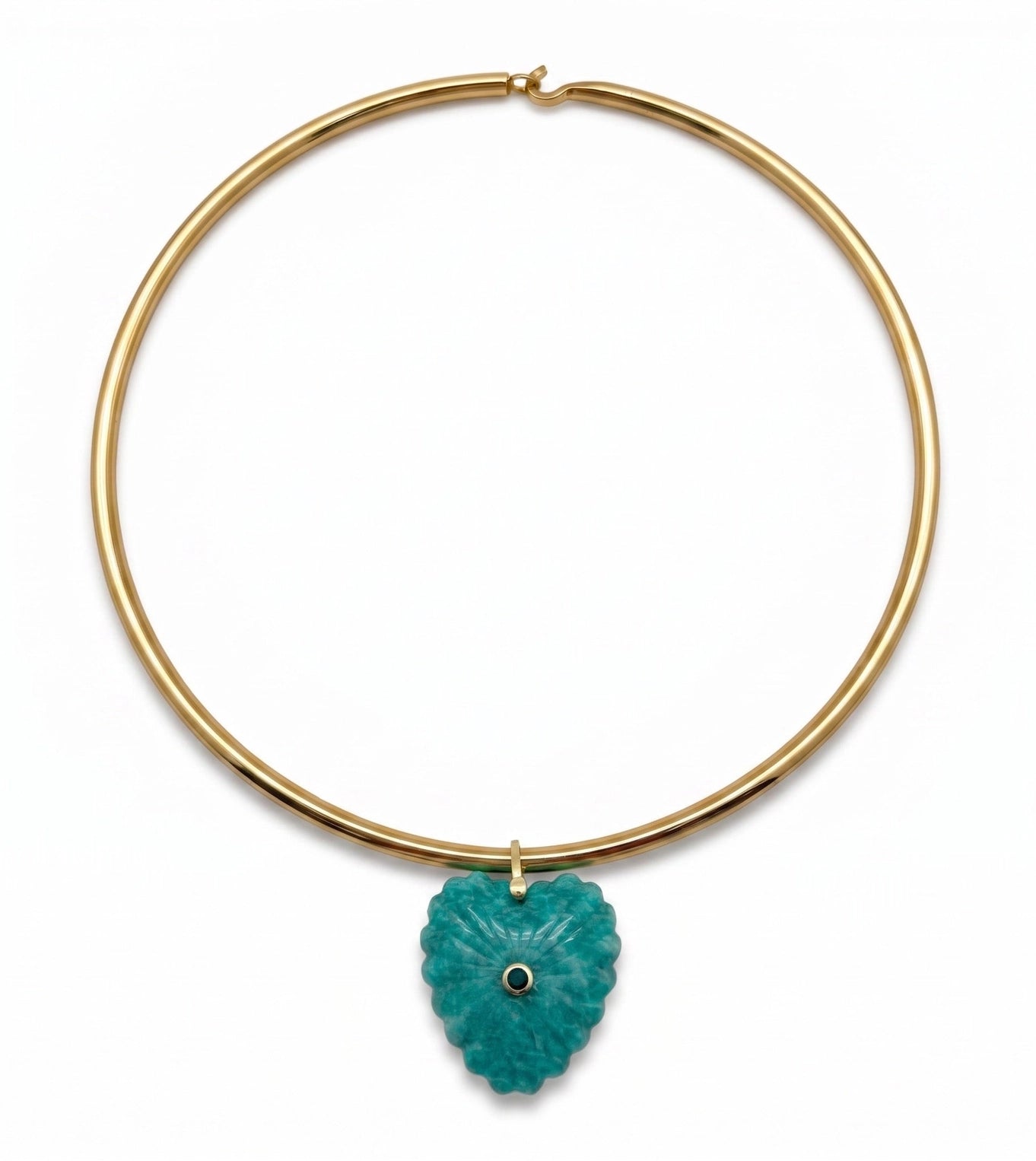 A gold-plated circular collar necklace featuring a textured, carved turquoise pendant with a small black eye detail in the center, shown against a plain white background.