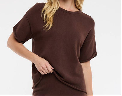Woman wearing a brown outfit on a white background