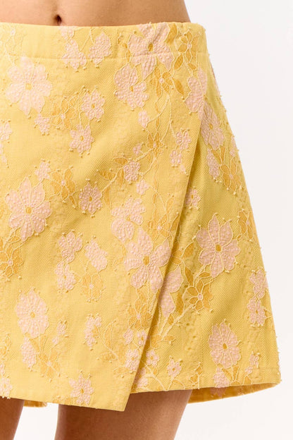 Yellow floral skirt on a white background