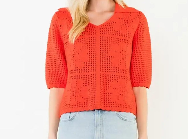 Woman wearing a red sweater and light blue denim skirt on a white background