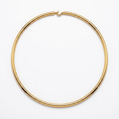 A thin, polished gold hoop necklace with a small spring-ring clasp, shown on a clean white background.