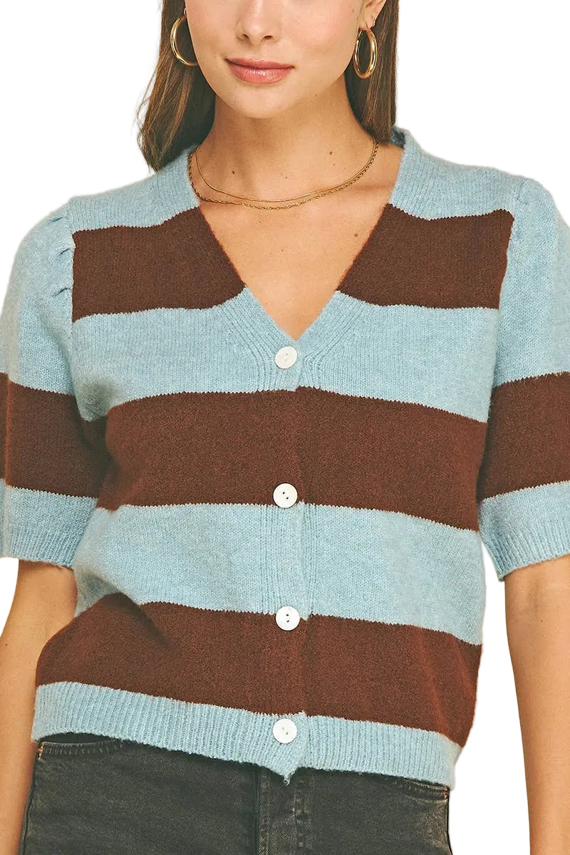 A woman wearing a short-sleeve knit cardigan with horizontal stripes in light blue and dark brown, featuring a V-neck and white buttons, set against a solid white background.