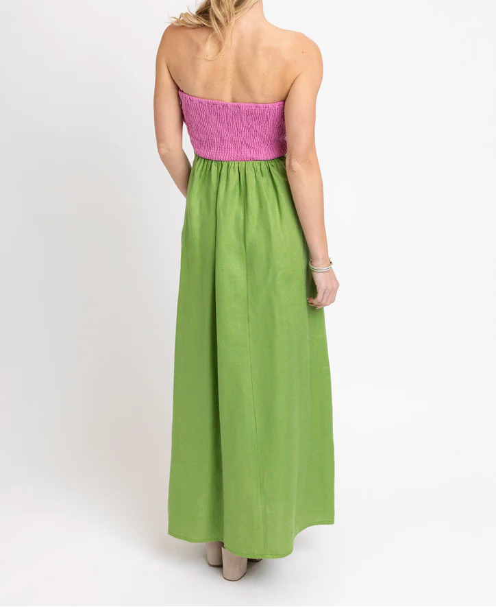 Woman wearing pink and green strapless dress