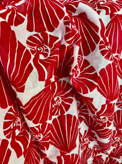 Red floral pattern on white fabric