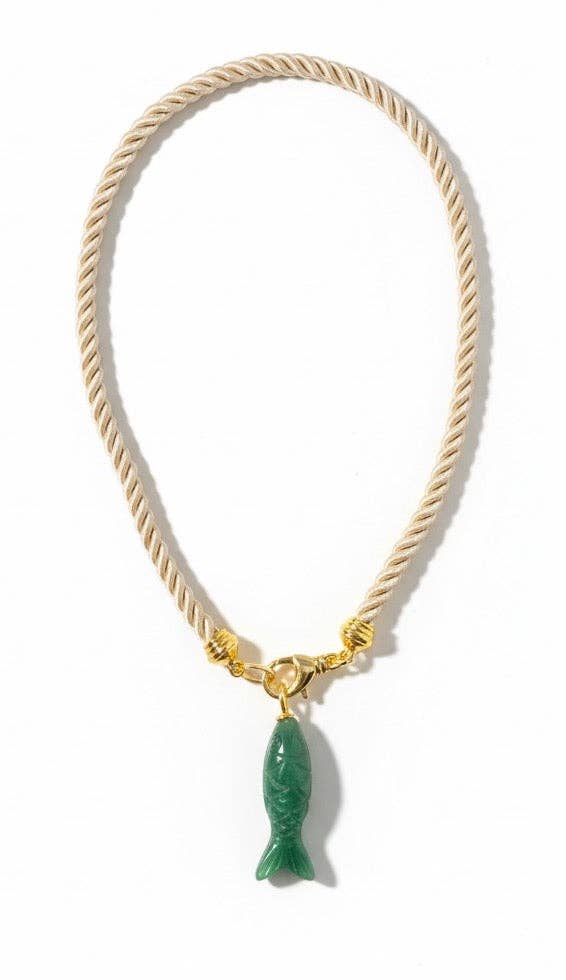 Necklace with a green fish pendant on a white background