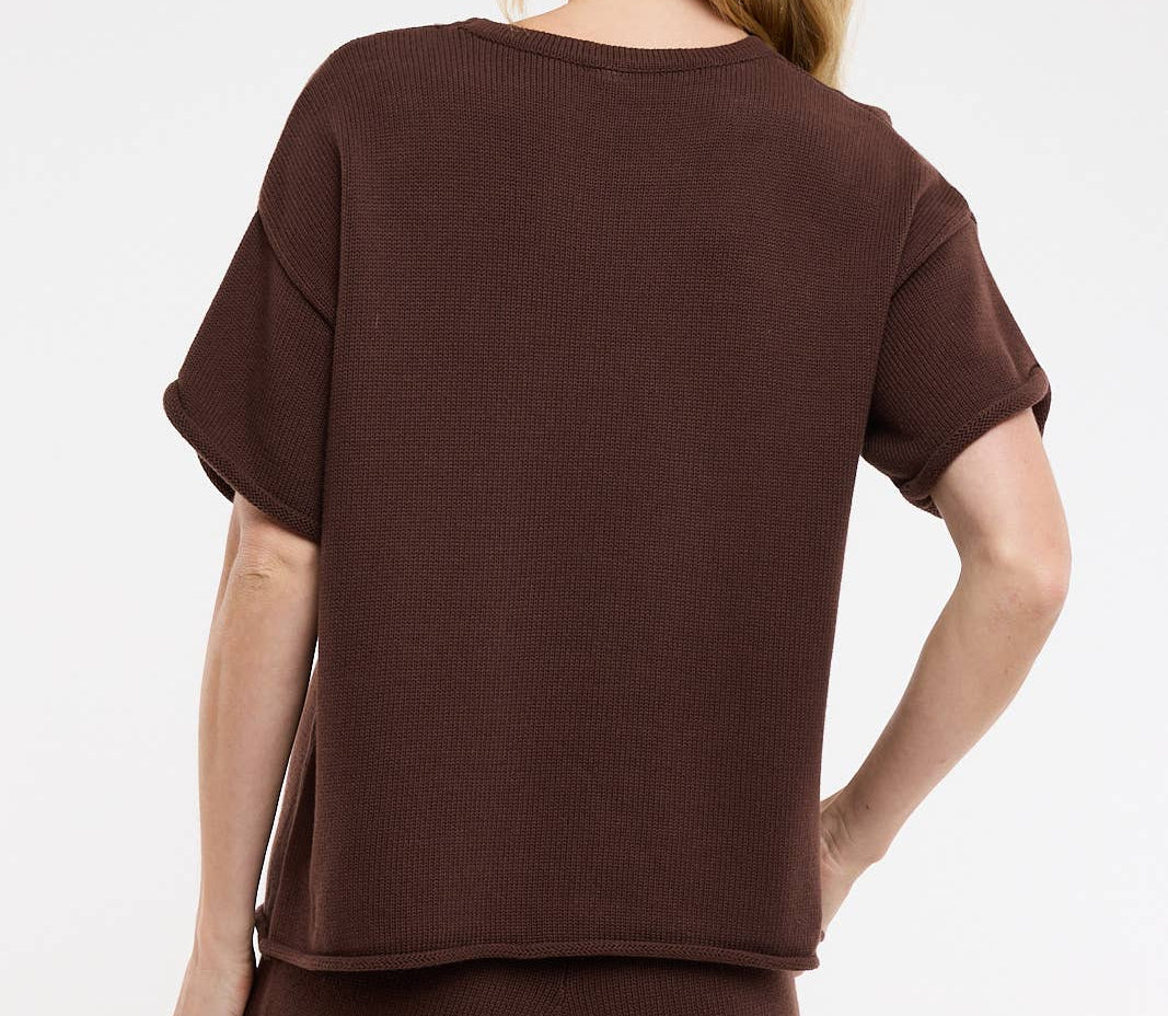 Woman wearing a brown outfit on a white background