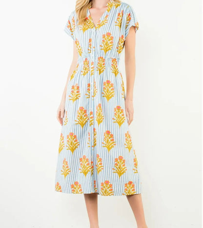 Woman wearing a floral dress with a white background