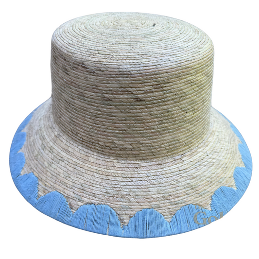 Woven hat with blue trim on a white background