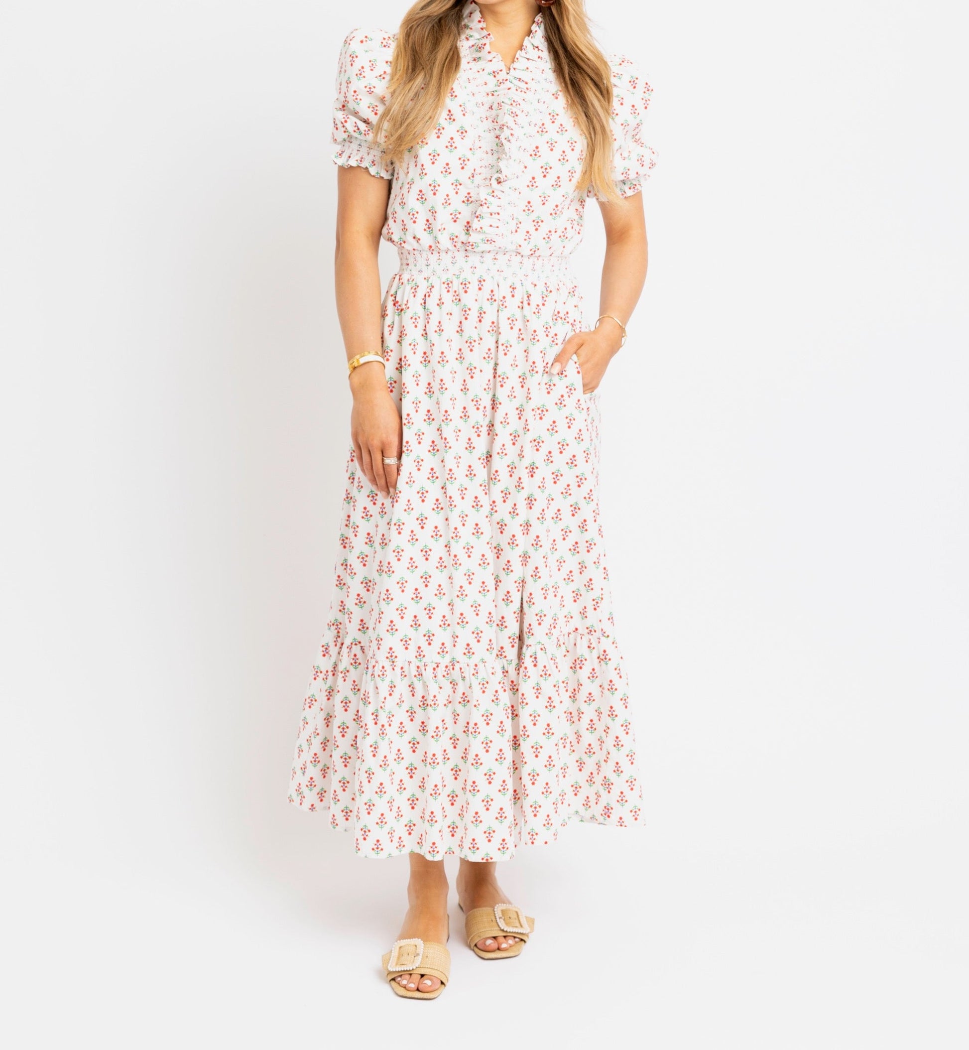 Woman wearing a floral dress on a white background
