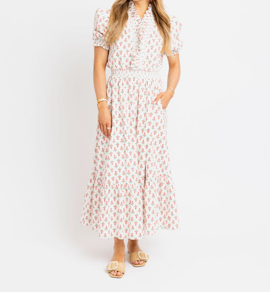 Woman wearing a floral dress on a white background