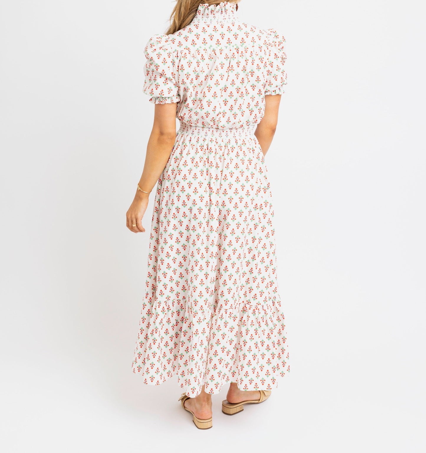 Woman wearing a floral dress on a white background