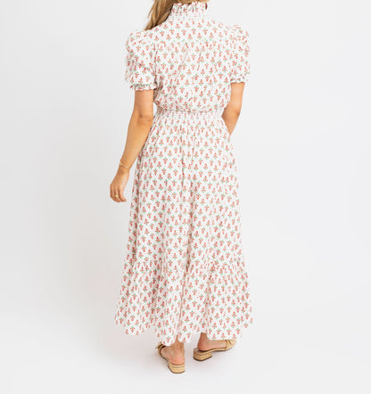 Woman wearing a floral dress on a white background
