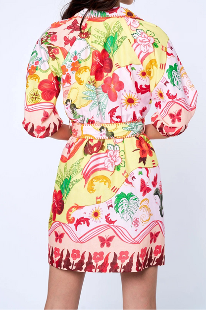 Woman wearing a colorful floral dress with a white background