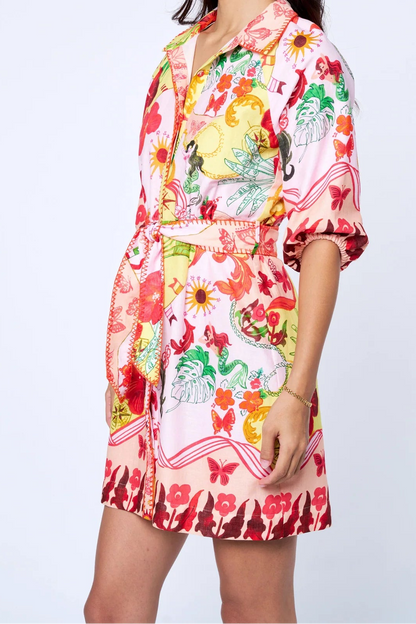 Woman wearing a colorful floral dress on a white background