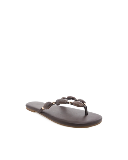 Brown sandal with decorative straps on a white background