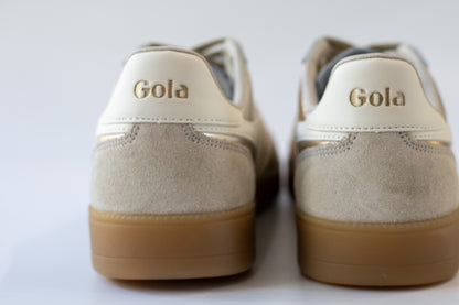 Pair of Gola sneakers with beige soles on a white background